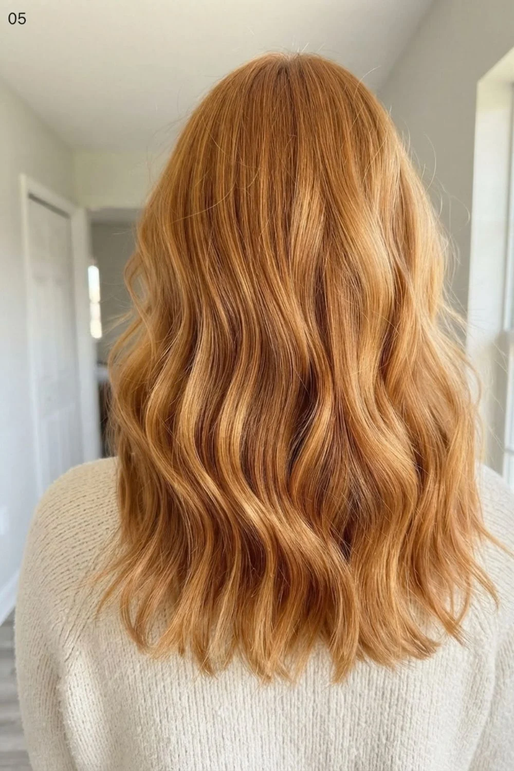 Golden copper hair with soft dimensional waves