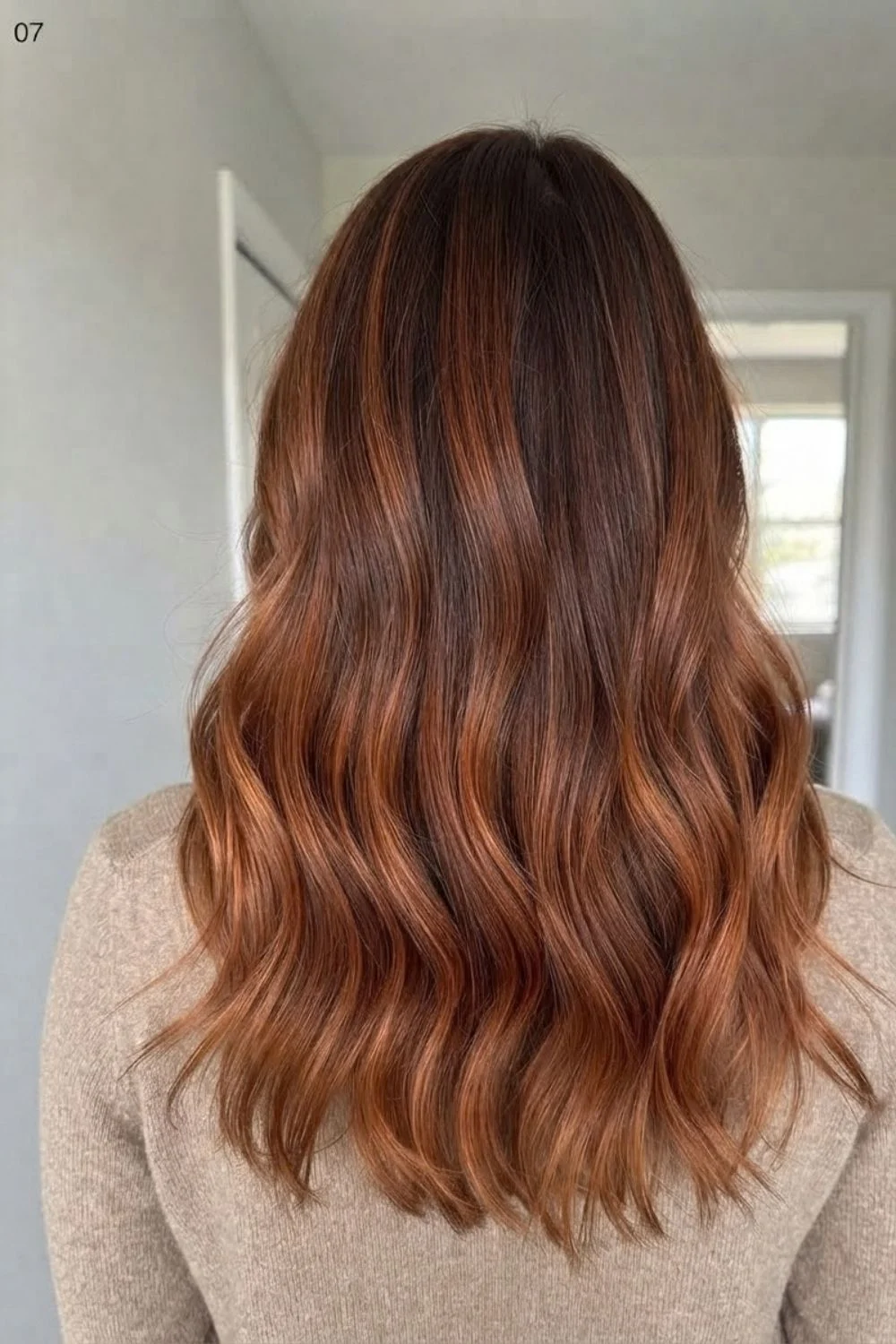 Dark-root copper melt with brunette roots and warmer copper lengths