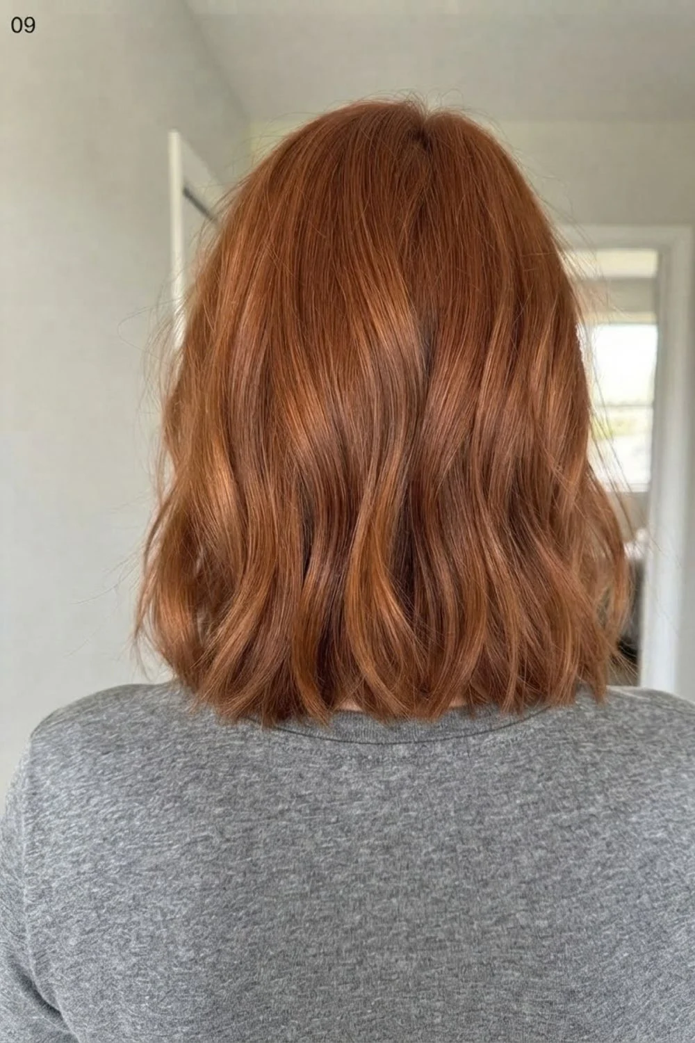 Lived-in textured copper lob with soft bends and natural movement
