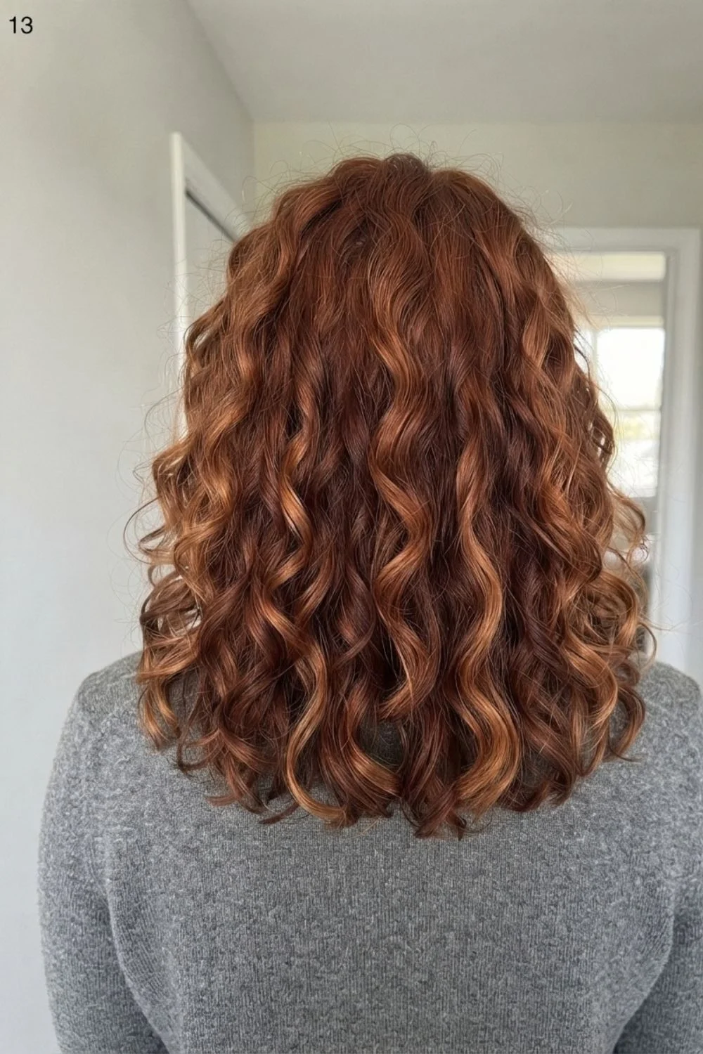 Copper dimension on natural curls with deeper and brighter warm sections