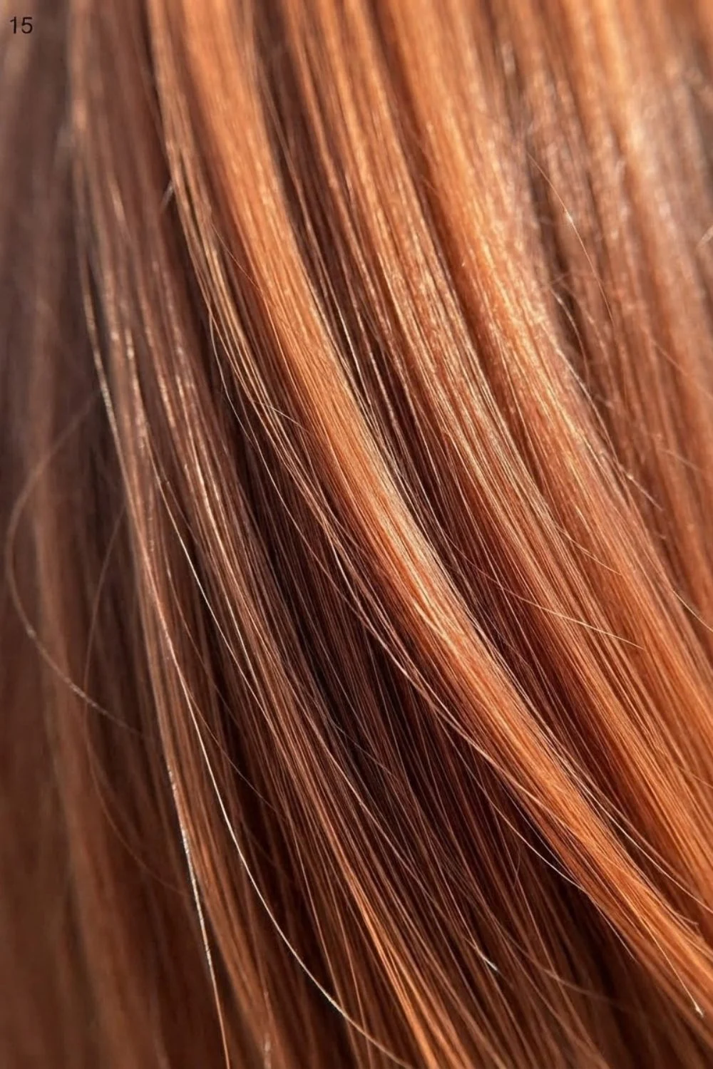Close-up copper ribbon detail showing darker and brighter warm strands